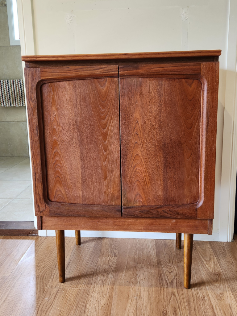 Original photo of a fully restored vintage teak Chiswell cabinet with incredible grain pattern