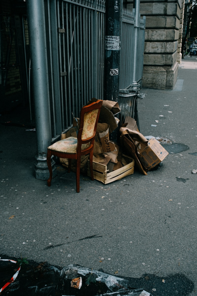 Discarded furniture on the street with the trash waiting for a DIY restoration project