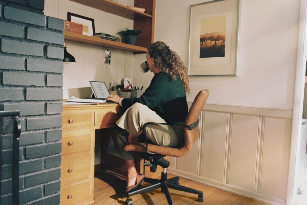 Woman working at desk with coffee online shopping