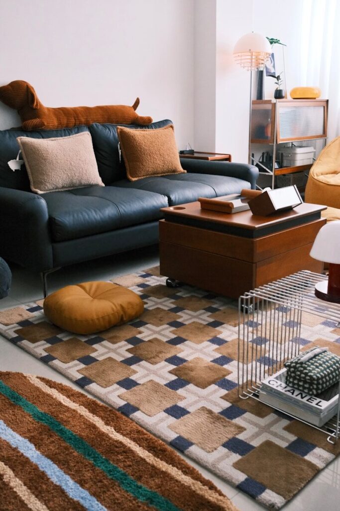 Cozy, unique living room with sofa, coffee table, and patterned rugs.