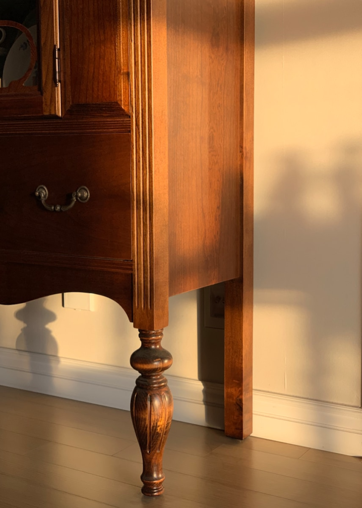 A restored DIY antique vintage wooden furniture piece in afternoon light