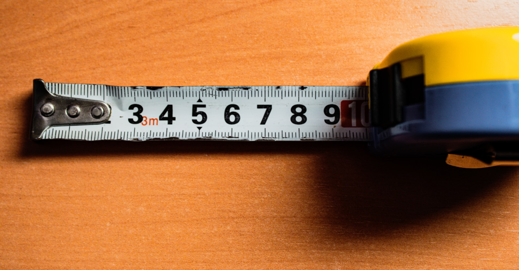 Measuring tape on a wooden table